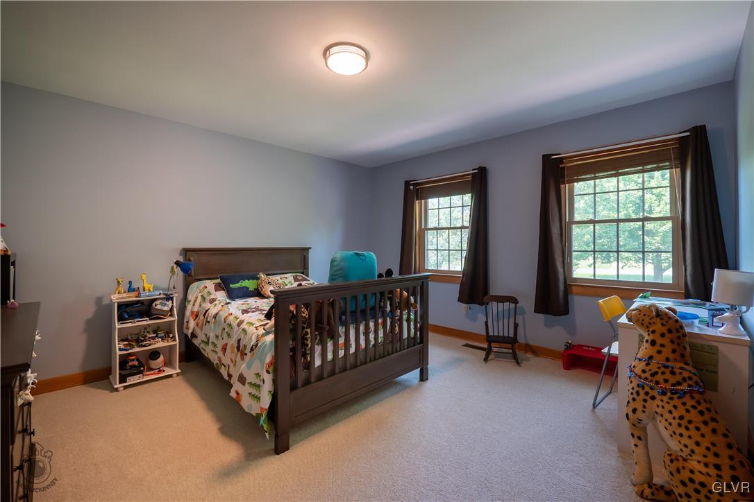 201 Ruth Road Bath, PA 18014 - Photo 12 of 49 a bedroom with a bed chair and a window