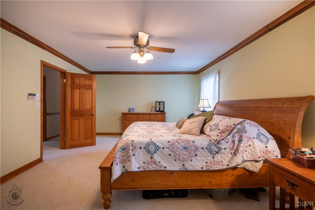 201 Ruth Road Bath, PA 18014 - Photo 14 of 49 a bedroom with a bed and wooden floor