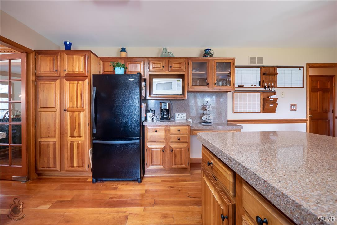 201 Ruth Road Bath, PA 18014 - Photo 23 of 49 a kitchen with stainless steel appliances granite countertop a refrigerator and a sink