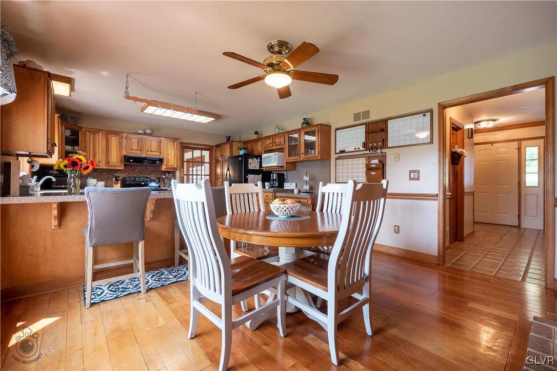201 Ruth Road Bath, PA 18014 - Photo 4 of 49 a dining room with furniture and wooden floor
