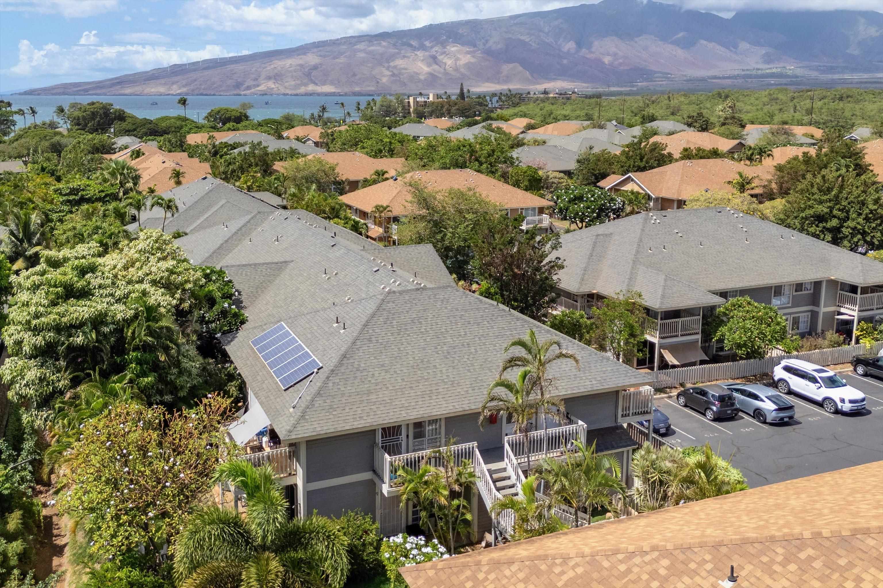140 Uwapo Road, Unit 19105 Kihei, HI 96753 - Photo 27 of 42 an aerial view of multiple houses with a yard