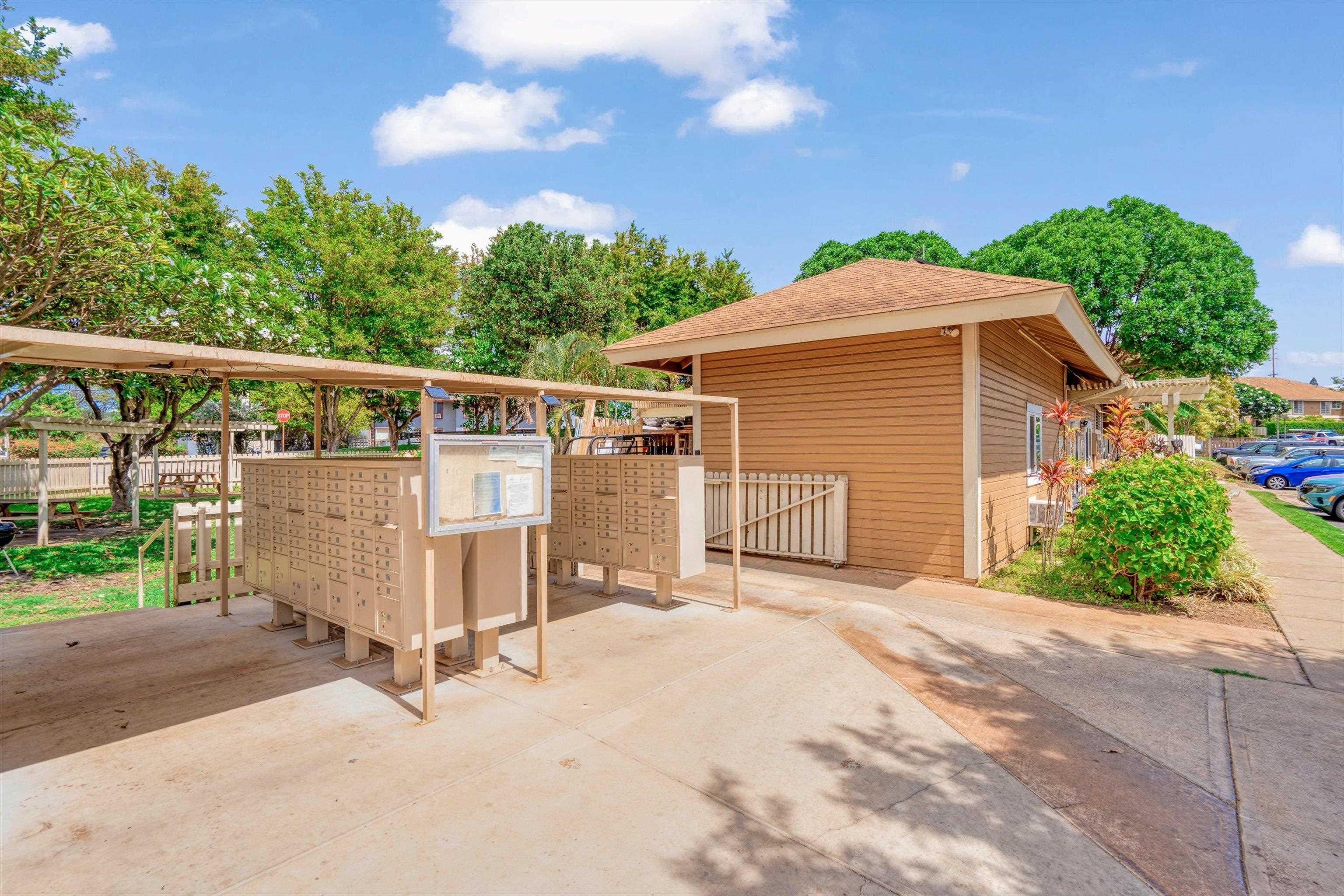 140 Uwapo Road, Unit 19105 Kihei, HI 96753 - Photo 31 of 42 a front view of a house with a garage