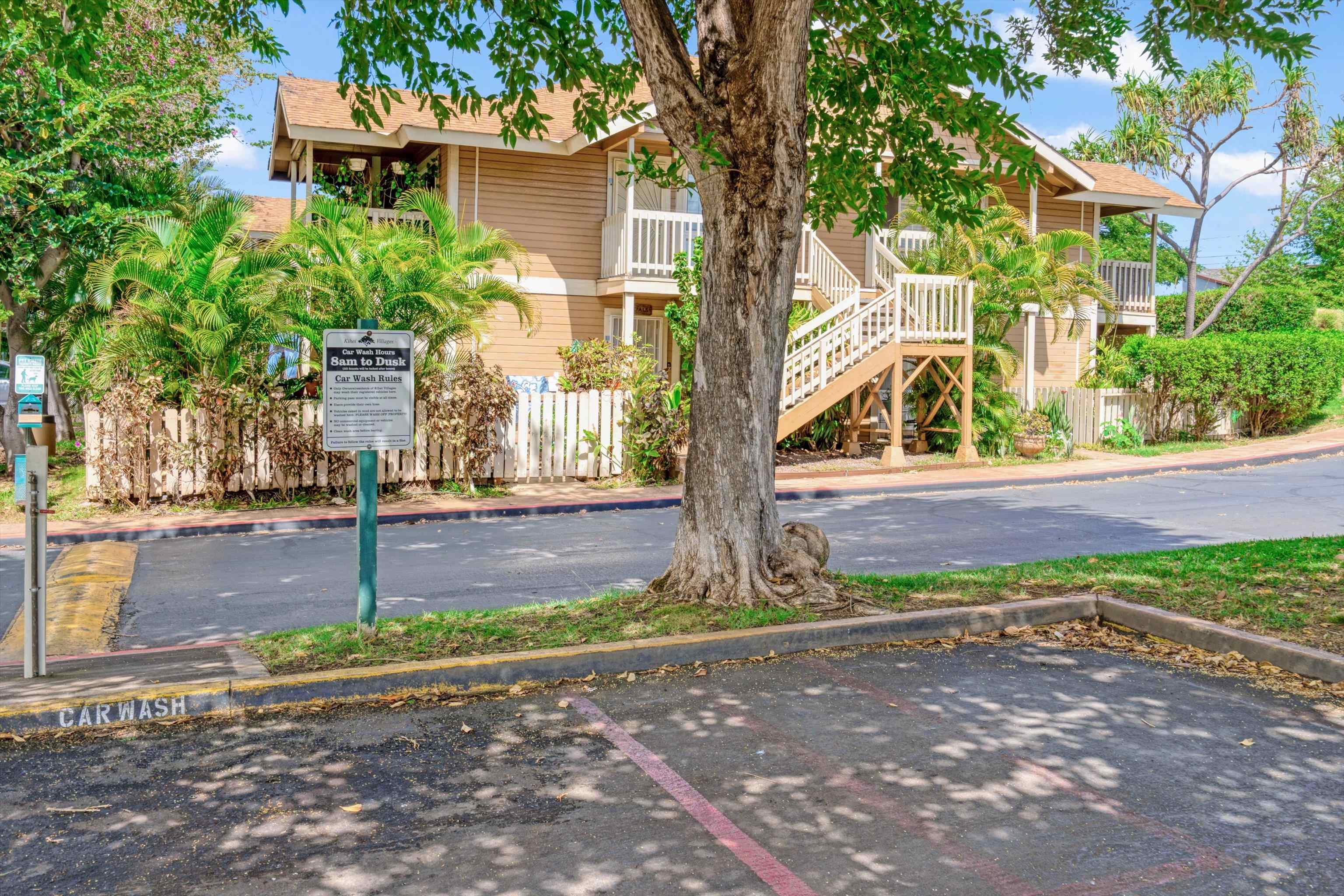 140 Uwapo Road, Unit 19105 Kihei, HI 96753 - Photo 32 of 42 a front view of a house with a yard
