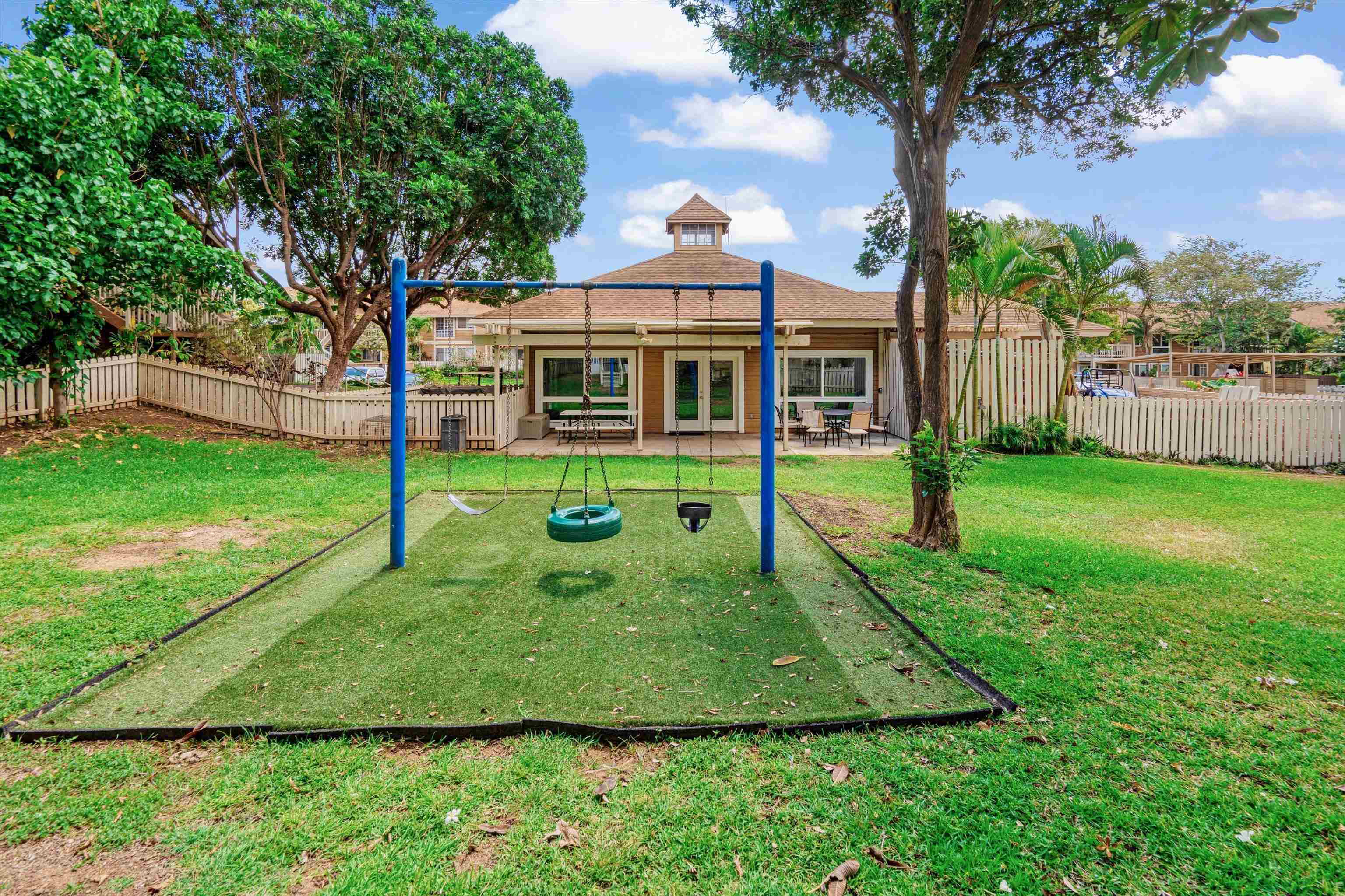 140 Uwapo Road, Unit 19105 Kihei, HI 96753 - Photo 34 of 42 a view of a house with backyard and a tree