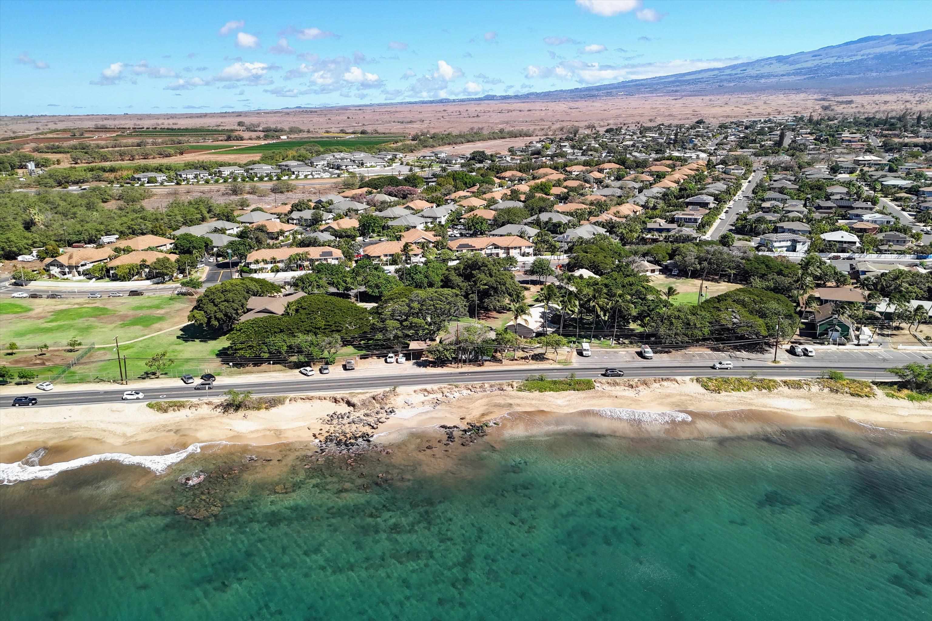 140 Uwapo Road, Unit 19105 Kihei, HI 96753 - Photo 41 of 42 an aerial view of residential houses with outdoor space