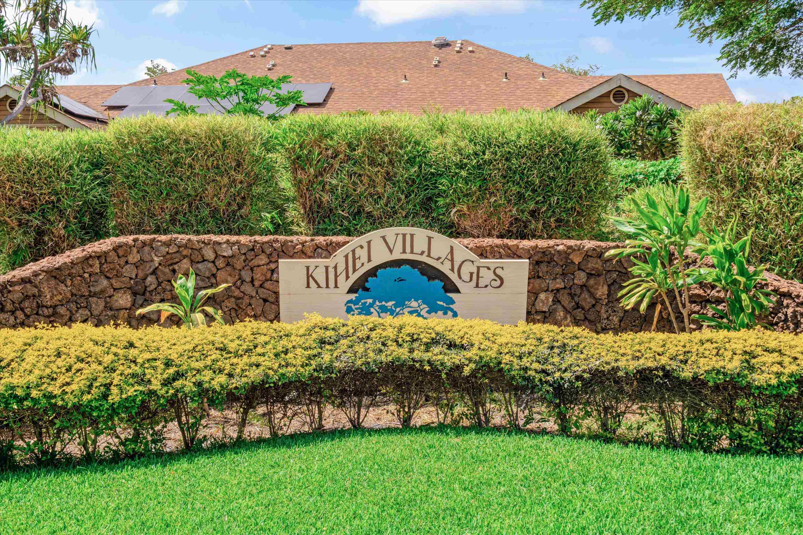 140 Uwapo Road, Unit 19105 Kihei, HI 96753 - Photo 42 of 42 a view of a garden with a houses in the background