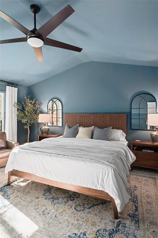 5800 Oakdale Road Southeast, Unit 150 Mableton, GA 30126 - Photo 16 of 36 a bedroom with a bed ceiling fan and a wooden floor