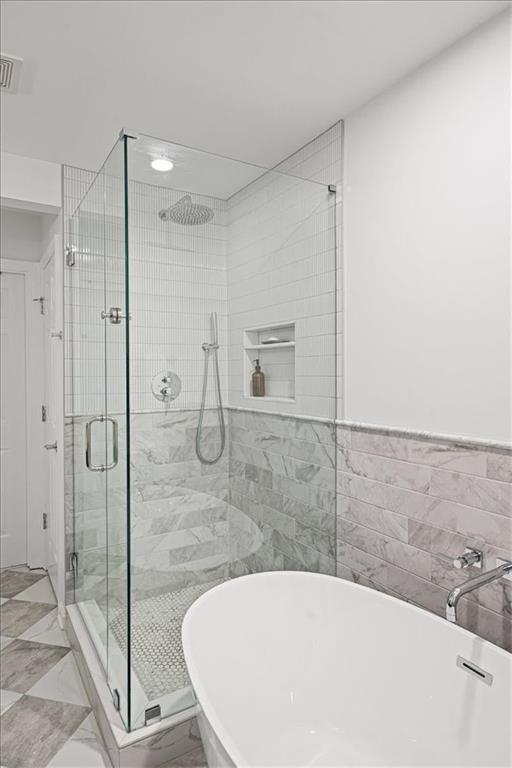 5800 Oakdale Road Southeast, Unit 150 Mableton, GA 30126 - Photo 19 of 36 a bathroom with a bathtub and a shower