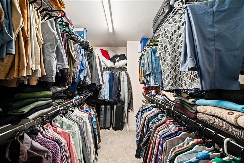 5800 Oakdale Road Southeast, Unit 150 Mableton, GA 30126 - Photo 23 of 36 a view of walk in closet with clothes and shoes