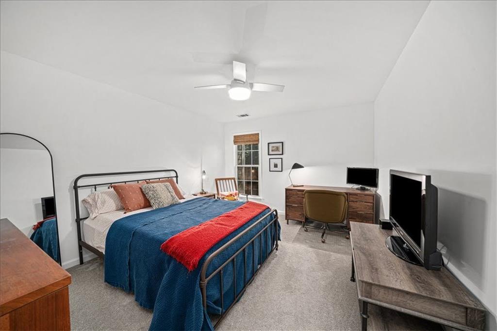5800 Oakdale Road Southeast, Unit 150 Mableton, GA 30126 - Photo 25 of 36 a bedroom with a bed and a desk
