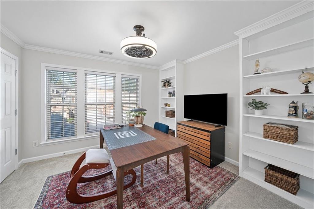 5800 Oakdale Road Southeast, Unit 150 Mableton, GA 30126 - Photo 29 of 36 a living room with furniture and a flat screen tv