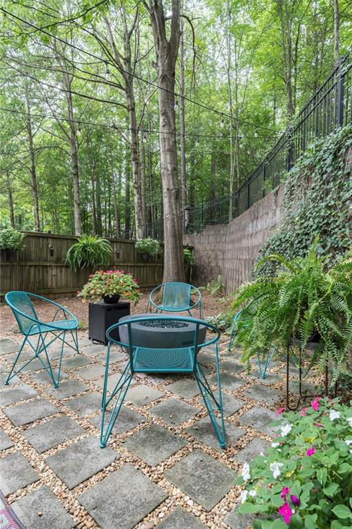 5800 Oakdale Road Southeast, Unit 150 Mableton, GA 30126 - Photo 30 of 36 a view of a bench in a backyard
