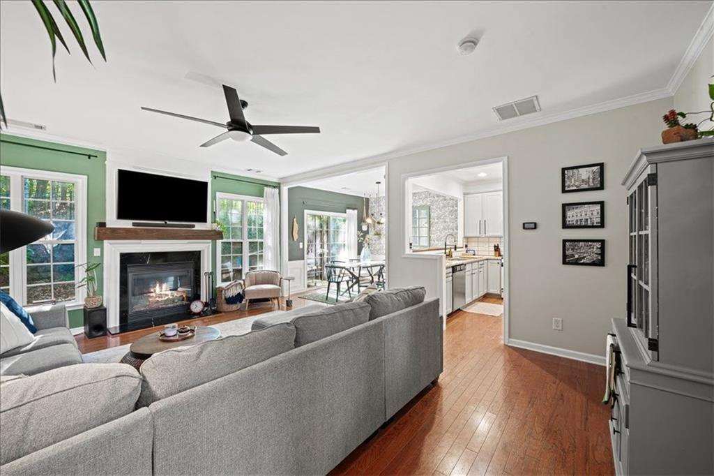 5800 Oakdale Road Southeast, Unit 150 Mableton, GA 30126 - Photo 7 of 36 a living room with furniture a fireplace a flat screen tv and a large window
