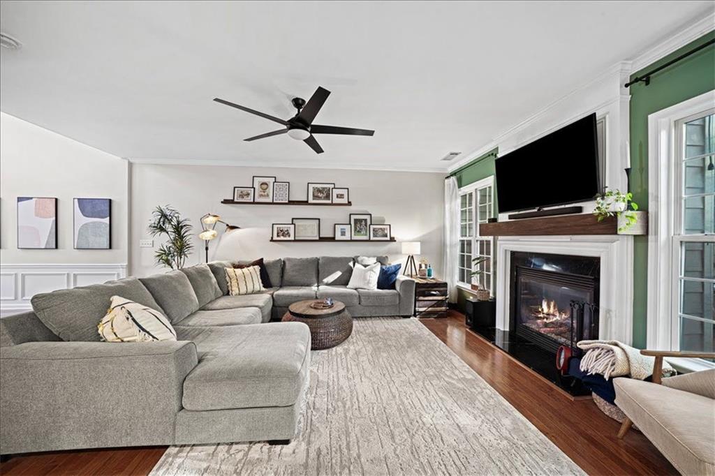 5800 Oakdale Road Southeast, Unit 150 Mableton, GA 30126 - Photo 8 of 36 a living room with furniture a flat screen tv and a fireplace