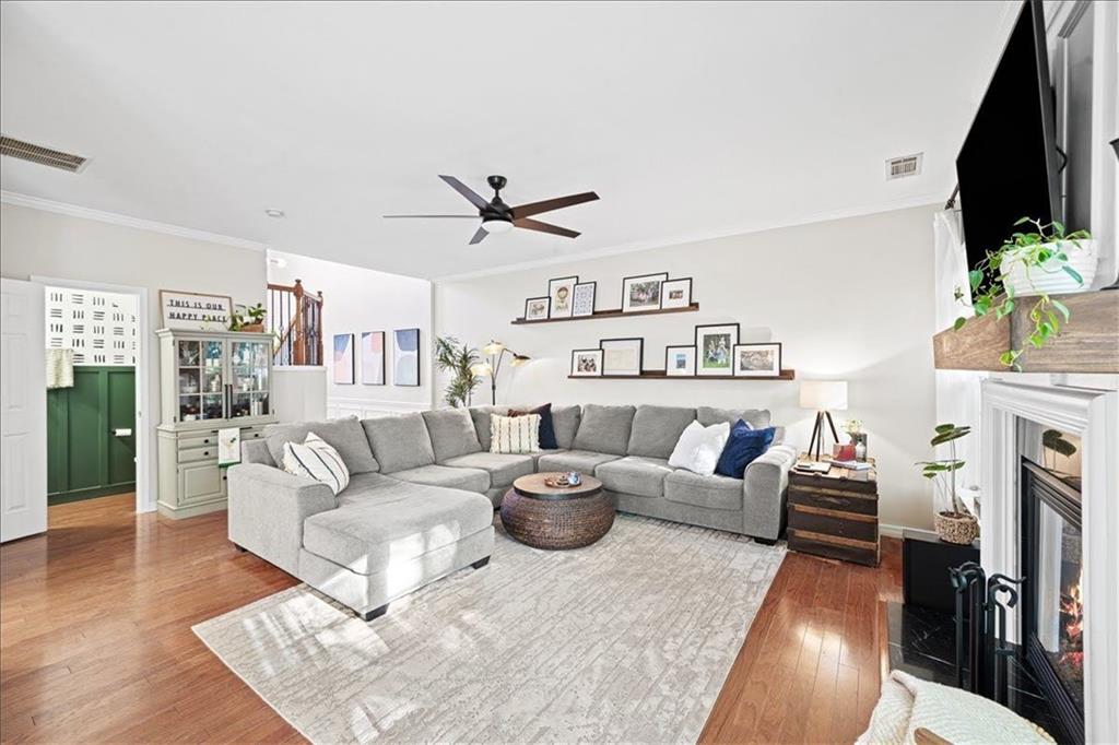 5800 Oakdale Road Southeast, Unit 150 Mableton, GA 30126 - Photo 9 of 36 a living room with furniture a flat screen tv and a fireplace