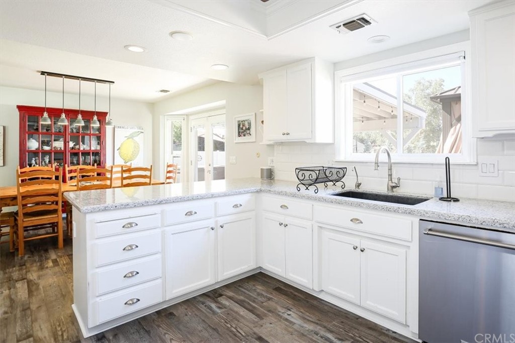 1585 Donelson Place Templeton, CA 93465 - Photo 11 of 37 a kitchen with cabinets appliances and a window