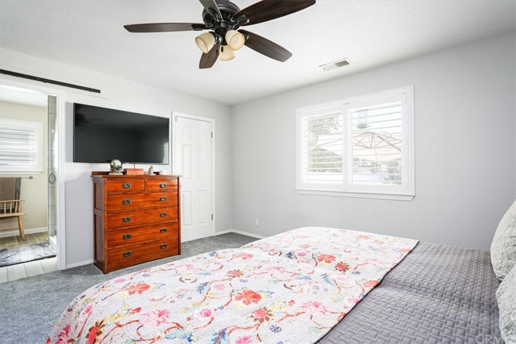 1585 Donelson Place Templeton, CA 93465 - Photo 20 of 37 a bedroom with a bed and a flat screen tv