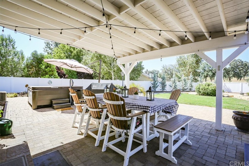 1585 Donelson Place Templeton, CA 93465 - Photo 24 of 37 a view of a patio with table and chairs under an umbrella