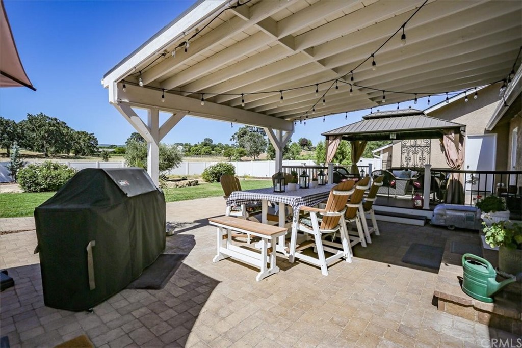1585 Donelson Place Templeton, CA 93465 - Photo 28 of 37 a view of a patio with table and chairs potted plants