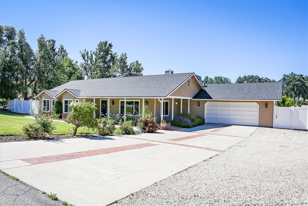 1585 Donelson Place Templeton, CA 93465 - Photo 3 of 37 a front view of a house with yard and green space