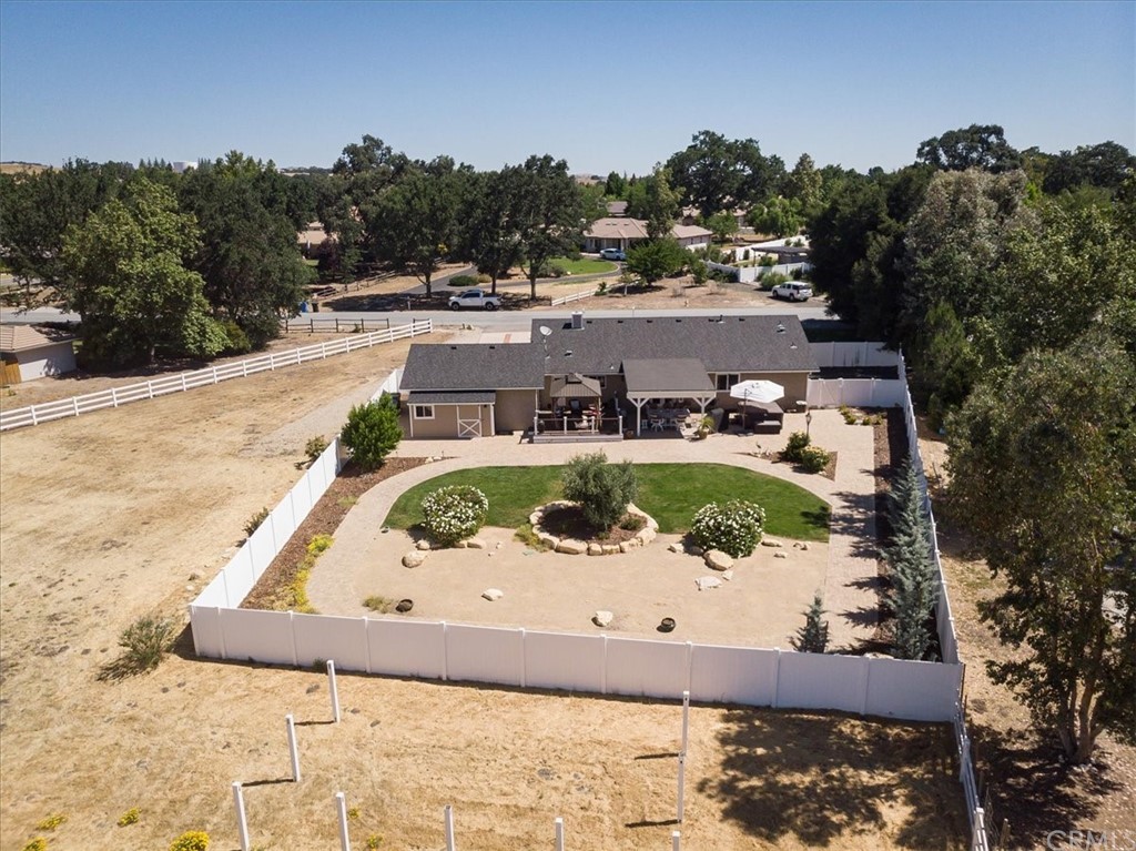 1585 Donelson Place Templeton, CA 93465 - Photo 36 of 37 a view of a swimming pool with outdoor seating and a garden