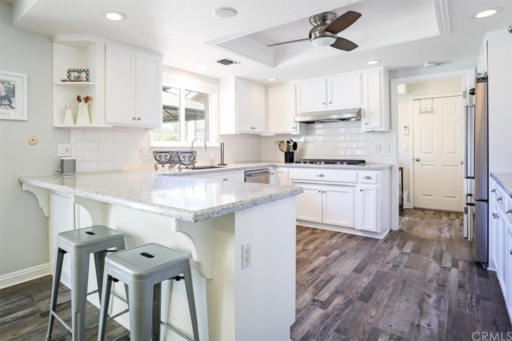 1585 Donelson Place Templeton, CA 93465 - Photo 9 of 37 a kitchen with a sink a cabinets and window