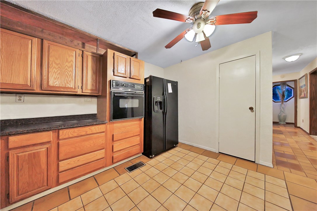 75072 Edwards Road Yulee, FL 32097 - Photo 11 of 27 a kitchen with stainless steel appliances granite countertop a refrigerator and a sink