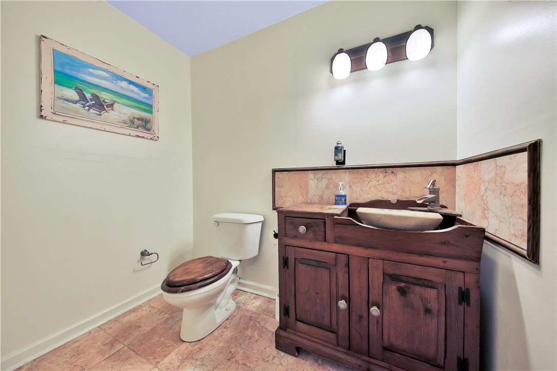 75072 Edwards Road Yulee, FL 32097 - Photo 17 of 27 a bathroom with a toilet and a sink
