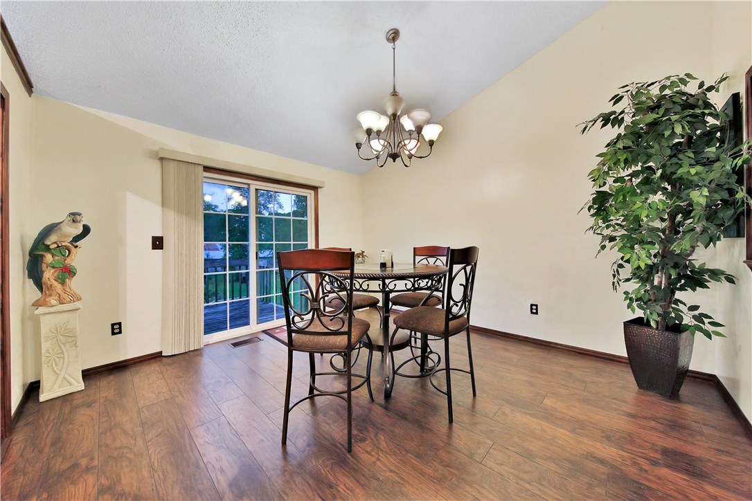 75072 Edwards Road Yulee, FL 32097 - Photo 4 of 27 a view of a dining room with furniture window and wooden floor