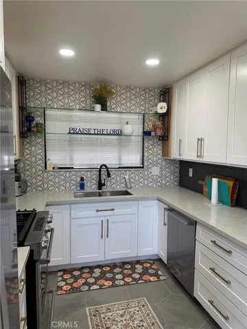 a kitchen with a sink and cabinets