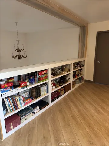 a view of an empty room with empty shelves