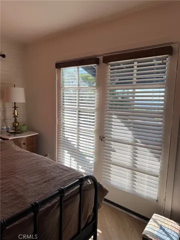 a view of a workspace with furniture and window