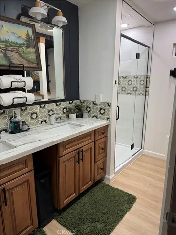 a bathroom with a sink double vanity and a mirror