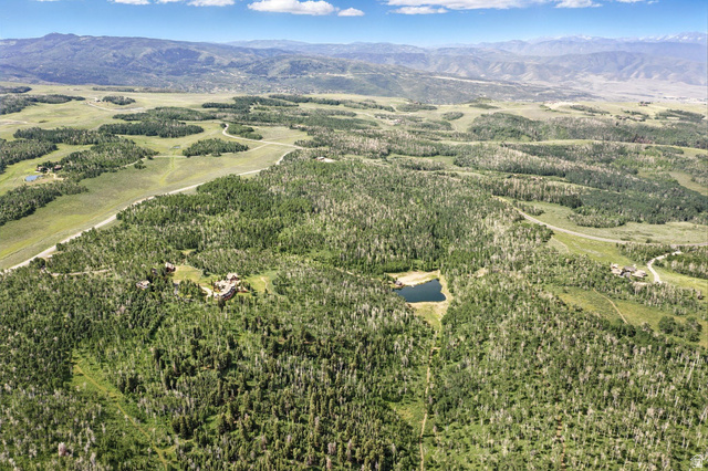 1555 North Wolf Creek Ranch Road, Unit 11 Heber City, UT 84036 - Photo 5 of 9 Expansive acreage featuring dense wooded areas, open clearings, and distant mountain ranges