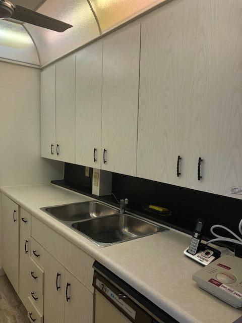 1044 Rexford Drive Boca Raton, FL 33434 - Photo 13 of 50 a kitchen with a sink and cabinets