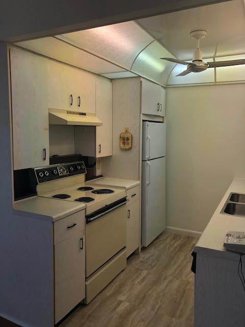 1044 Rexford Drive Boca Raton, FL 33434 - Photo 15 of 50 a kitchen with a sink appliances and cabinets