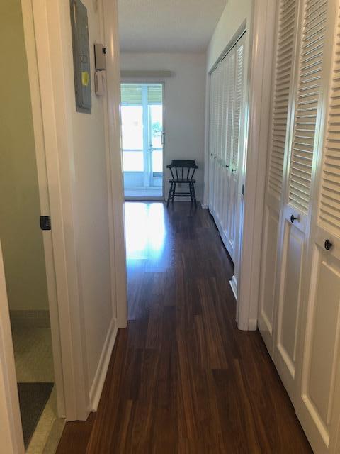 1044 Rexford Drive Boca Raton, FL 33434 - Photo 19 of 50 a view of hallway with wooden floor