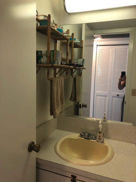 1044 Rexford Drive Boca Raton, FL 33434 - Photo 21 of 50 a bathroom with a sink and a mirror