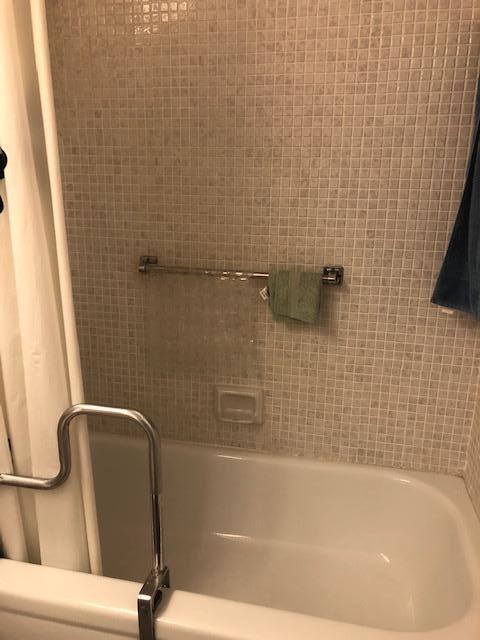 1044 Rexford Drive Boca Raton, FL 33434 - Photo 29 of 50 a bathroom with a bathtub