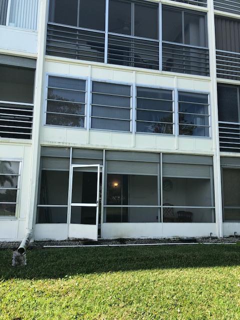 1044 Rexford Drive Boca Raton, FL 33434 - Photo 32 of 50 a view of a backyard with wooden floor and a window