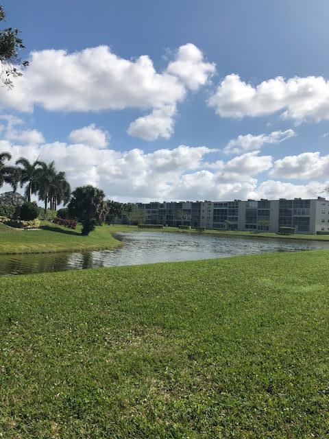 1044 Rexford Drive Boca Raton, FL 33434 - Photo 33 of 50 a view of a lake with a big yard