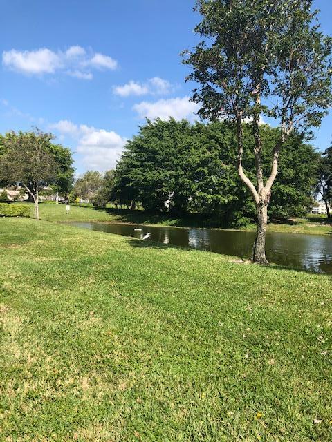 1044 Rexford Drive Boca Raton, FL 33434 - Photo 34 of 50 a view of outdoor space with deck and green space