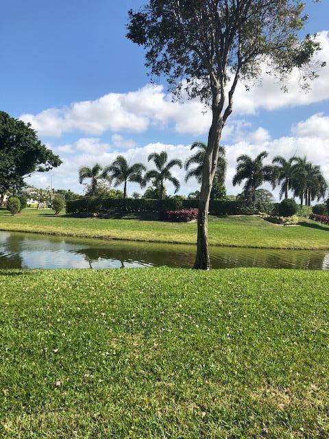 1044 Rexford Drive Boca Raton, FL 33434 - Photo 35 of 50 a view of a golf course with a lake view