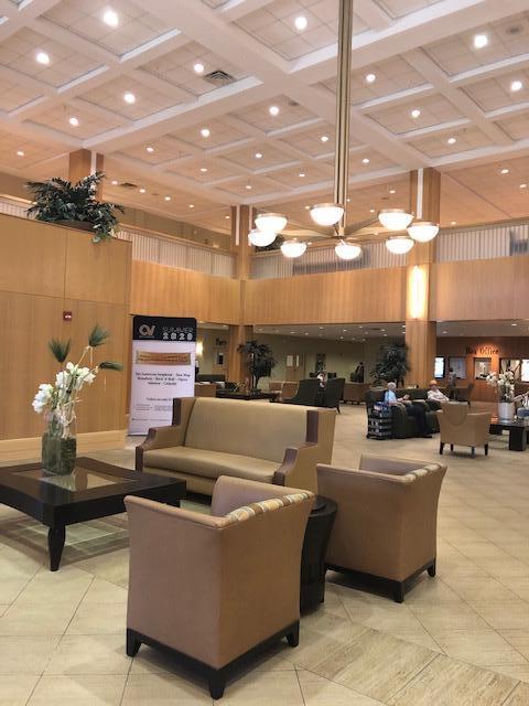 1044 Rexford Drive Boca Raton, FL 33434 - Photo 39 of 50 a living room with lots of furniture and a chandelier