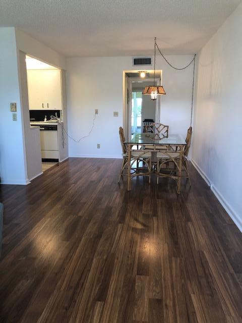 1044 Rexford Drive Boca Raton, FL 33434 - Photo 4 of 50 a view of a dining room with furniture window and wooden floor