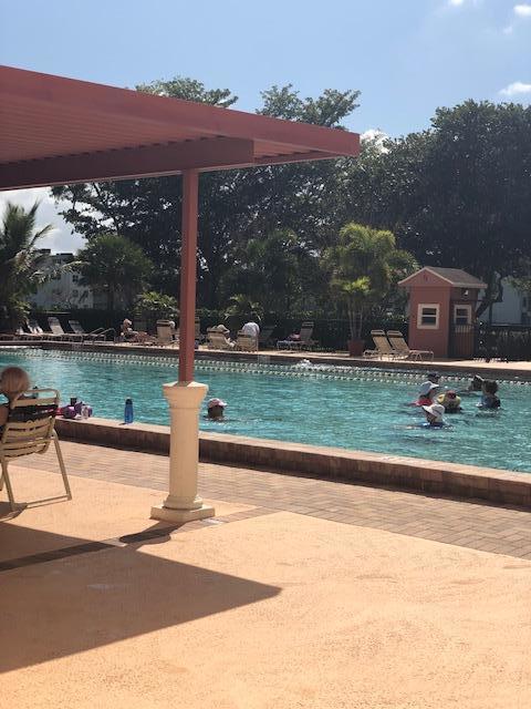 1044 Rexford Drive Boca Raton, FL 33434 - Photo 44 of 50 a view of a terrace with a yard