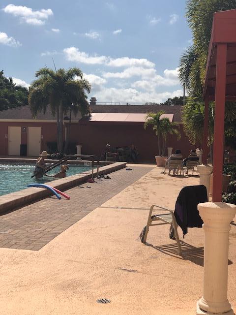 1044 Rexford Drive Boca Raton, FL 33434 - Photo 47 of 50 a view of swimming pool with lounge chair