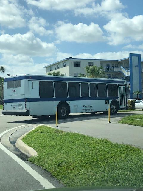 1044 Rexford Drive Boca Raton, FL 33434 - Photo 49 of 50 a view of a house with backyard sitting area and pool