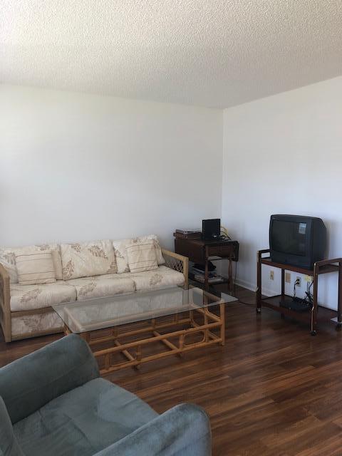 1044 Rexford Drive Boca Raton, FL 33434 - Photo 5 of 50 a living room with furniture and a wooden floor