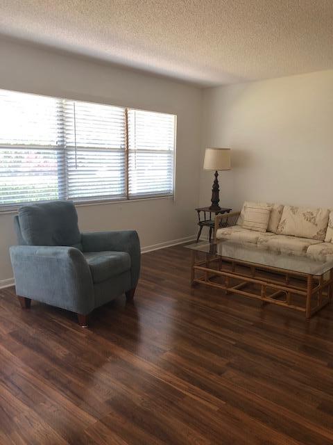 1044 Rexford Drive Boca Raton, FL 33434 - Photo 7 of 50 a living room with furniture and a large window